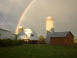 Photograph of rainbows over the winery.